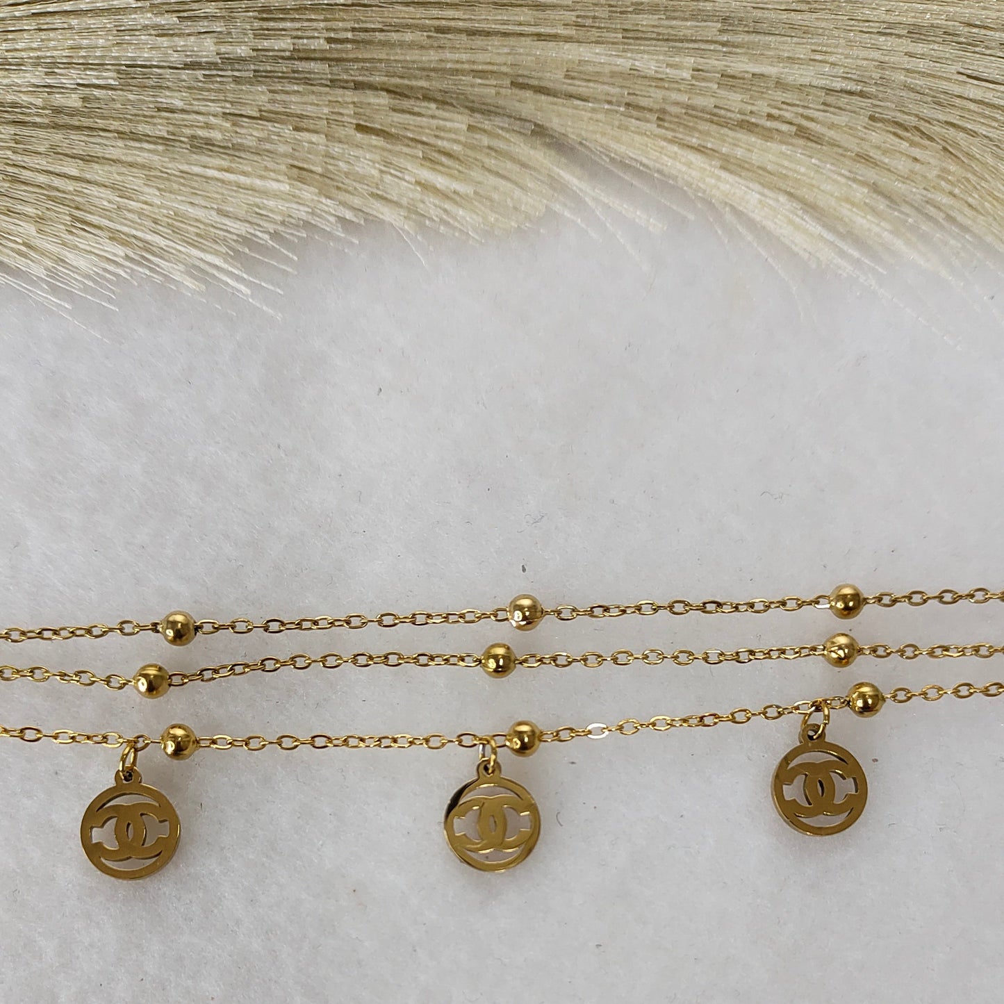 Layered round charm bracelet