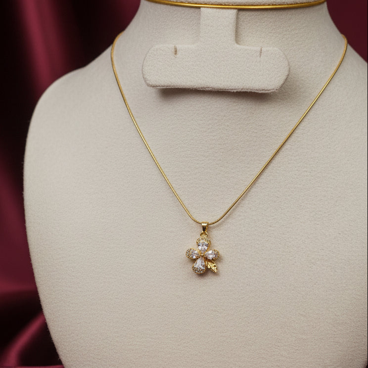Gold framed white flower pendant necklace