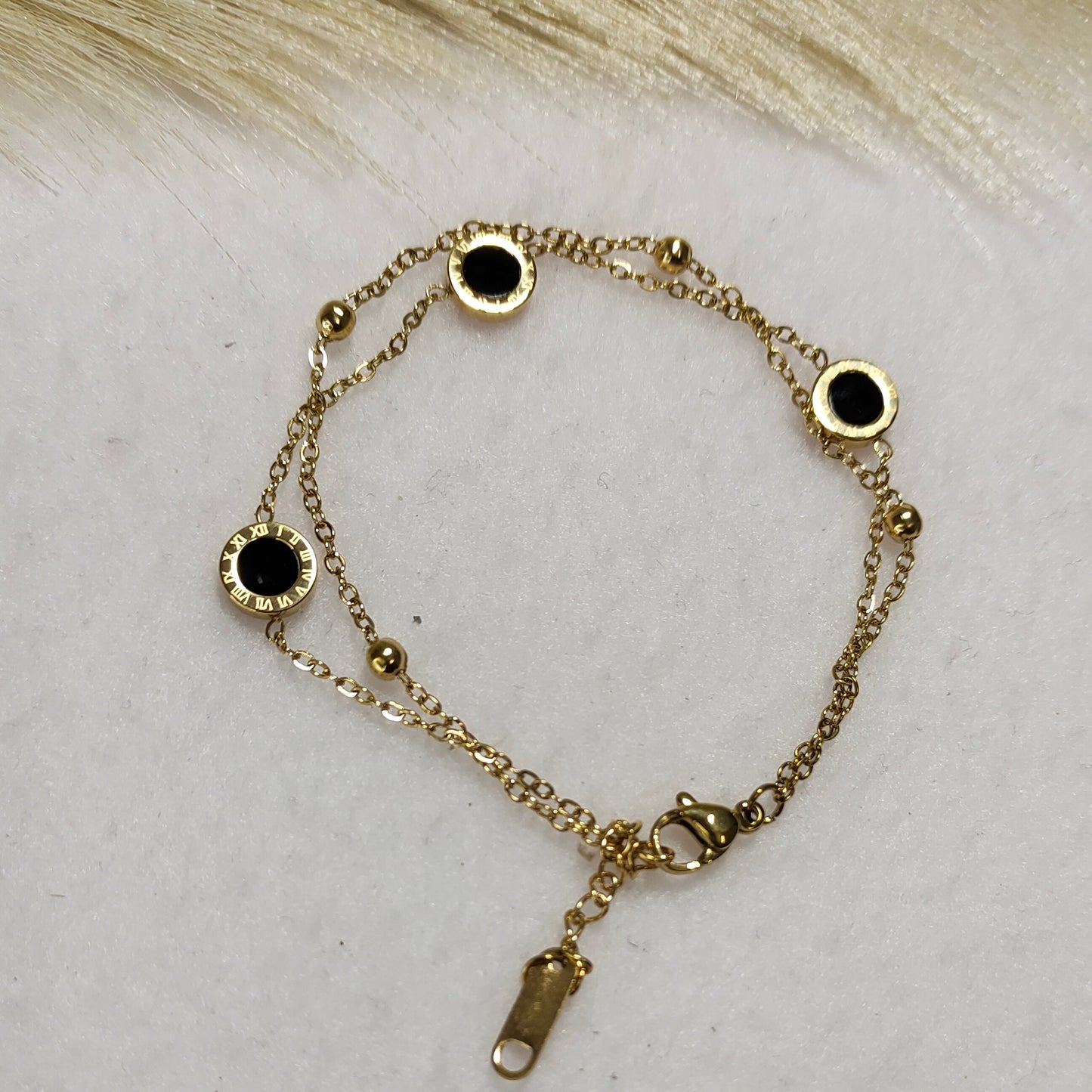 Layered charm bracelet
