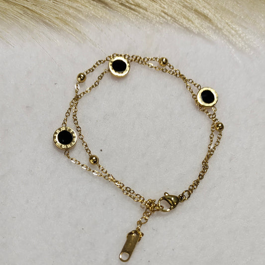 Layered charm bracelet