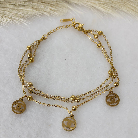 Layered round charm bracelet
