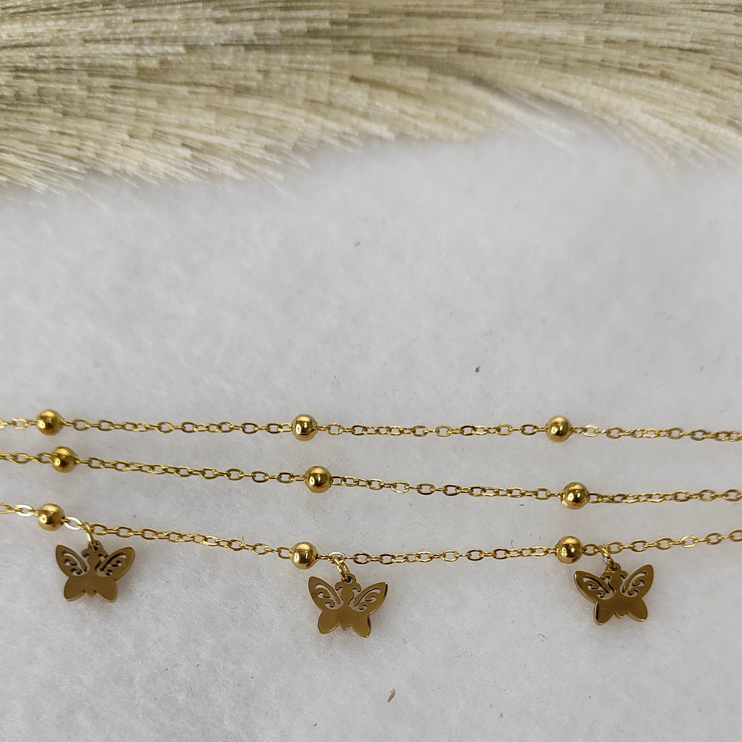 Layered butterfly charm bracelet